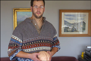 21st Barclay Lecture by Randy Buckner- image of Randy Buckner holding human brain model