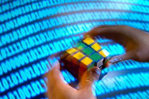 CNLM fellow Pierre Baldi's deep learning algorithm solves Rubik's Cube faster than any human - image of person with Rubik's cube