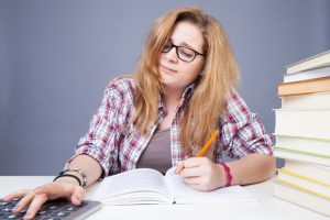 Using stimulants to cram for exams ruins sleep and doesn't help test scores - image of stressed student
