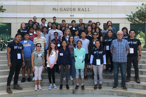 UC Irvine Summer Brain Camp - Registration Now Open! - Image of Brain Camp students in front of McGaugh Hall with Neuroscience expert Jim McGaugh