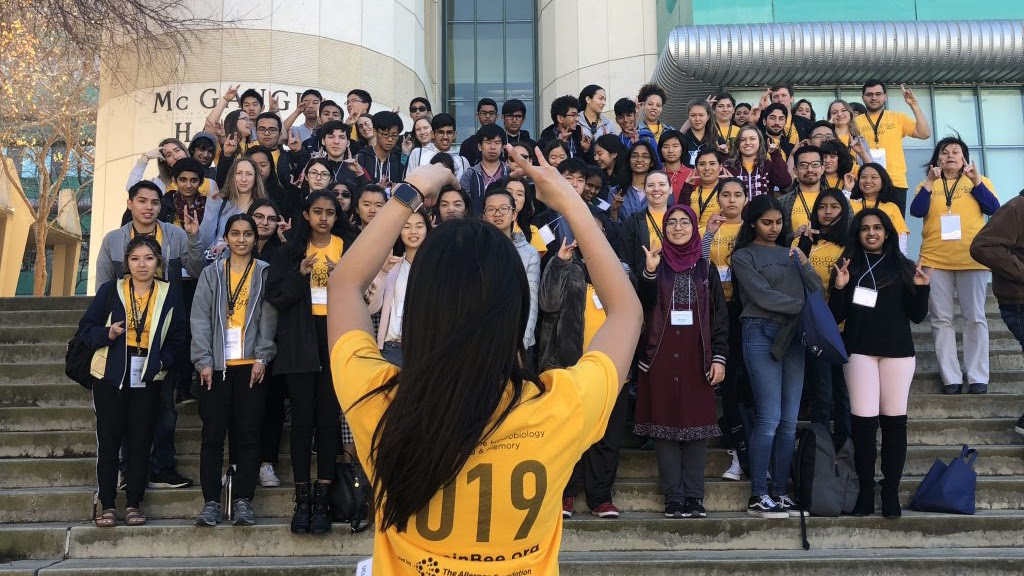 Calling all high schoolers! Join us for the Irvine Brain Bee March 5 - Image of person taking picture of 2019 Brain Bee Participants