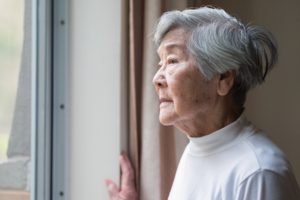 Frequent and Feared. But Can Dementia Be Avoided? Featuring CNLM Fellow, Claudia Kawas - Image of older woman staring out window