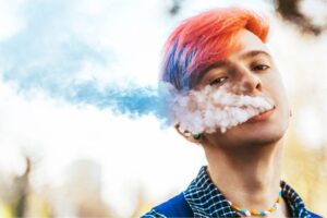 Warning! Nicotine poses special risks to teens - Image of teen smoking cigarette