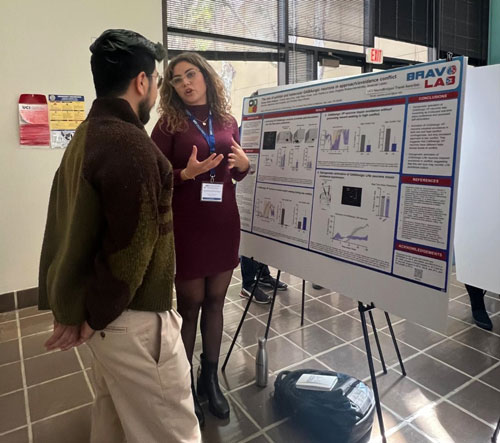 Pamela Perez-Vazquez presenting a poster of her research at the 2024 CNLM Spring Meeting.