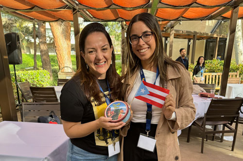 CNLM Director of Outreach and Education Manuella Yassa and CNLM Travel Award recipient Alison Santos-Marquez pose in the CNLM courtyard at UC Irvine.