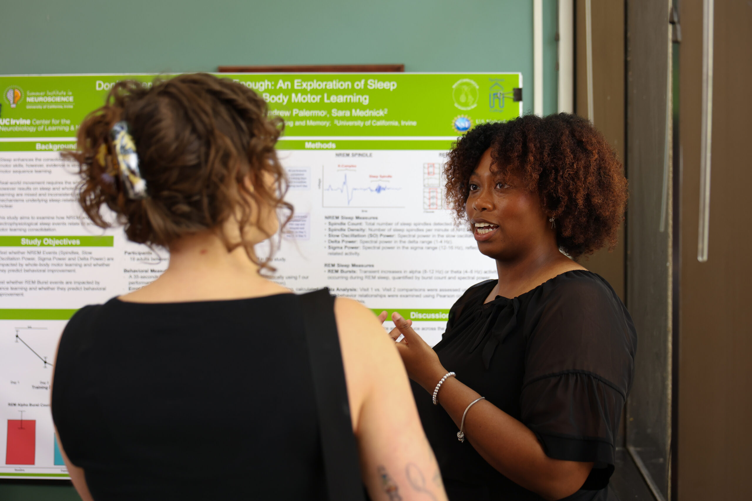Summer Institute student presenting her research at the 2026 Symposium