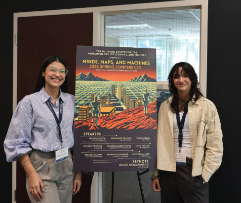 2026 recipients of the CNLM award, Paulette Vazquez Martinez (left) and Andrea Garcia Quinones (right) standing with the 2026 Spring Conference poster.