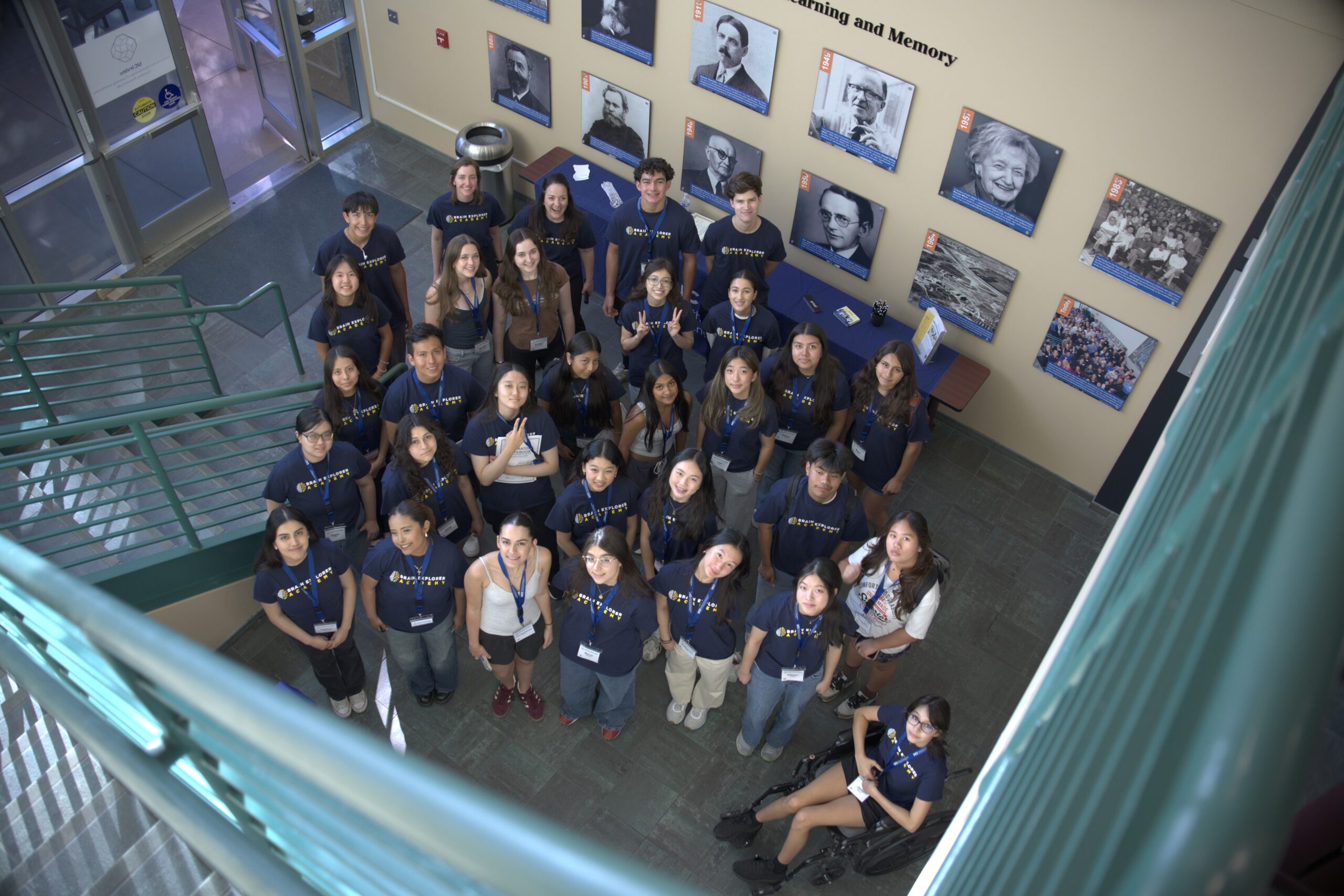 Brain explorer academy students gathered around in the CNLM lobby