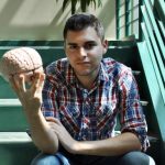 Rachon Sweiss holds human brain model